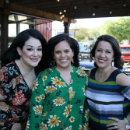 Photo of Texas Ұ alumni on the patio of a restaurant
